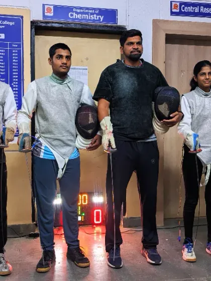 Our Khelo India Youth Games qualifiers Kartik, Arjun, and Anushka with me at our training facility. This photo was taken just before they left to represent the club at the national level.
