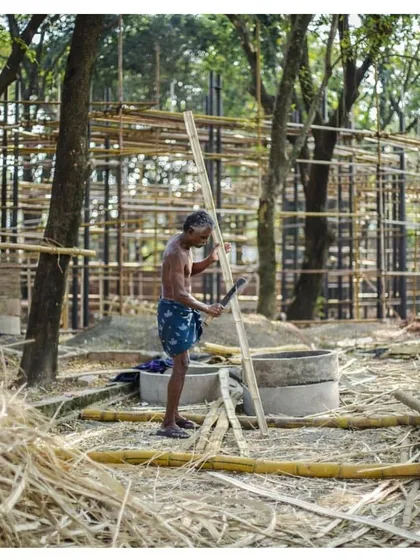 A craftsman at work during the construction of the Koodaaram Pavilion. The project celebrated local materials and building techniques, particularly the use of bamboo.
