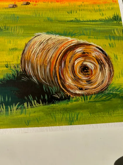 A detailed shot of the rolled haystack from my landscape painting. I used fine brushstrokes to give it a realistic, textured look.