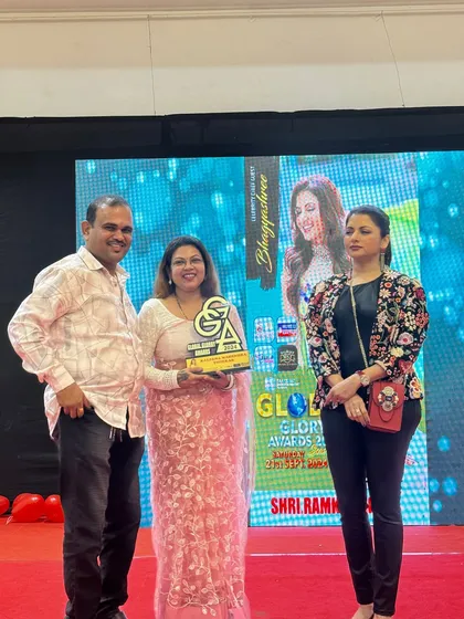 On stage with my team and other dignitaries at the Global Glory Awards. Success is a team effort, and I am grateful for the support around me.
