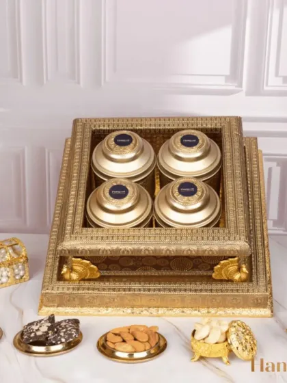 The Utsaah Gift Hamper is designed to celebrate Diwali with health and indulgence. It features gluten-free bliss bars, almond brittle, and roasted nuts packed in a beautiful antique-finish box.