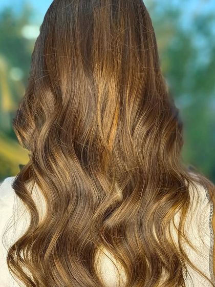 A close-up of this client's gorgeous, wavy balayage. The best result is hair that looks as good in natural light as it does in the salon.