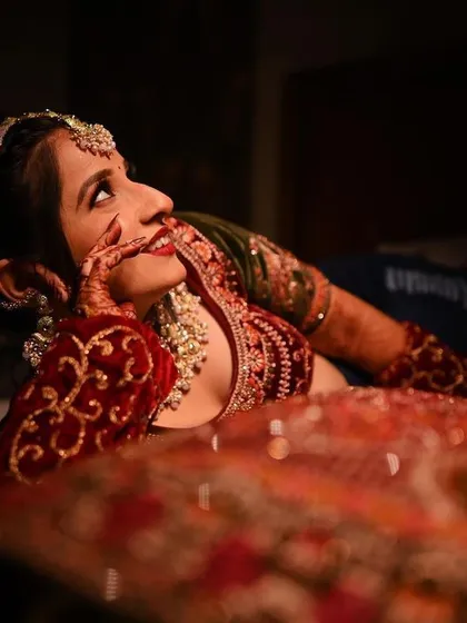 A candid and dreamy bridal portrait, capturing a moment of happy contemplation before the ceremony.