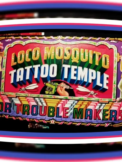 A sign for Loco Mosquito Tattoo Temple in Bangkok, Thailand. The lettering is flanked by bearers and the phrase "For Trouble Makers."