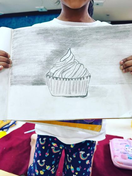 This cupcake sketch was done by a six-year-old student. It's so wonderful to see them learn about shading.