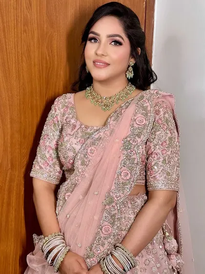 A close-up portrait that captures the essence of this soft glam look. Her eyes are beautifully defined without being heavy, and her skin is absolutely glowing.