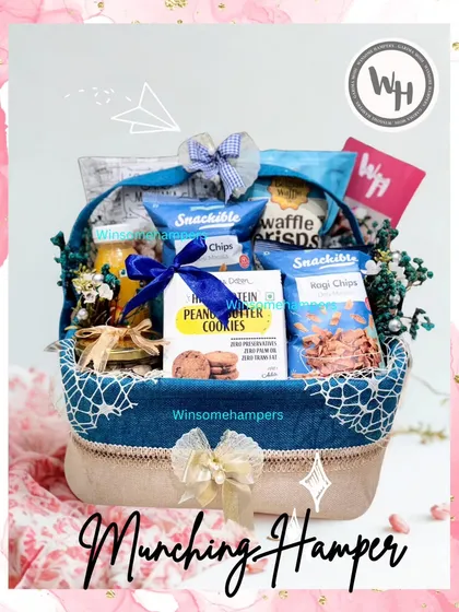 Another look at the 'Munching Hamper', this time with a soft pink background, highlighting its versatility as a gift for any personality.