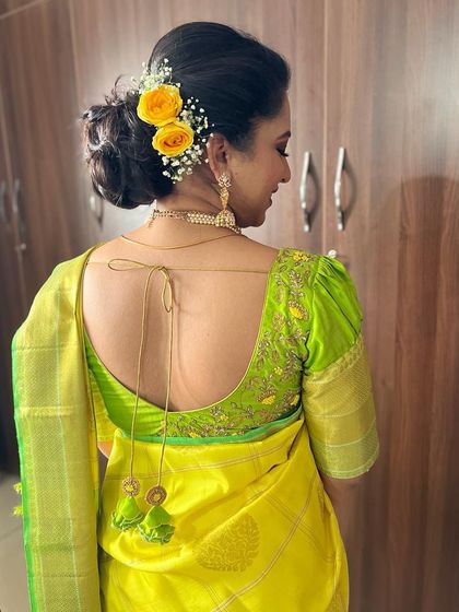 Our client Shriyanka looking beautiful in a lime green Kanjeevaram saree with a custom hand-embroidered blouse.