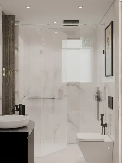 A wider view of our pristine white and grey marble bathroom. The design features a glass shower partition, matte black fixtures, and a floating vanity to create a space that is both sophisticated and serene.