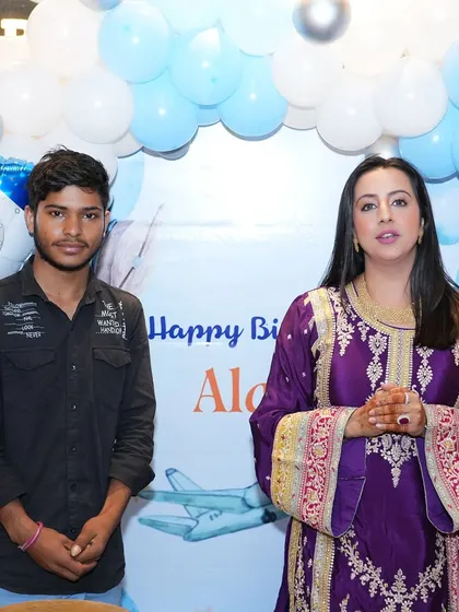 Another great shot of Sanjjanaa Galrani in front of the 'Happy Birthday Alarik' backdrop we designed. Capturing these happy moments is why I love what I do.