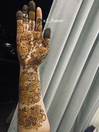 A close-up of the intricate work on one arm, showcasing the variety of patterns used.