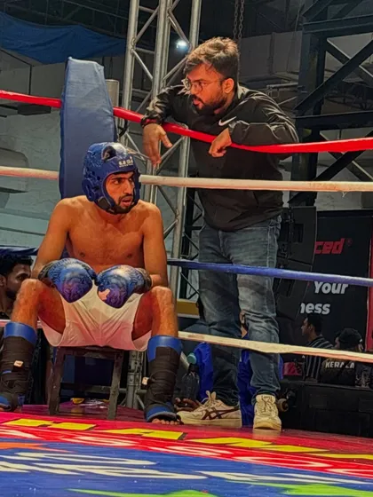 A moment of focus between rounds. I'm giving my fighter the adjustments he needs to win the next round.