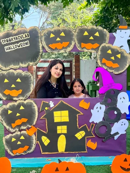 A mother and daughter duo at our Halloween photo booth. These shared experiences strengthen the bond between home and school.