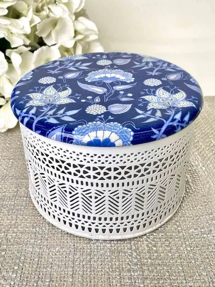 Experience artful storage with our distinctive Samarkand Filigree Box. The intricate white metal filigree paired with a blue and white printed lid makes it a stylish haven for your treasures.
