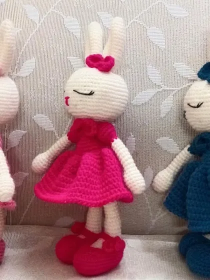 I can make my bunny dolls in any color you like. This trio shows the same design in three different dress colors: light pink, hot pink, and blue.