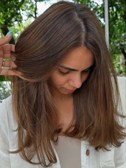 I love that this client comes all the way from New York for her hair sessions. This is a classic color refresh, where I blend her roots and brighten her highlights for a seamless look.