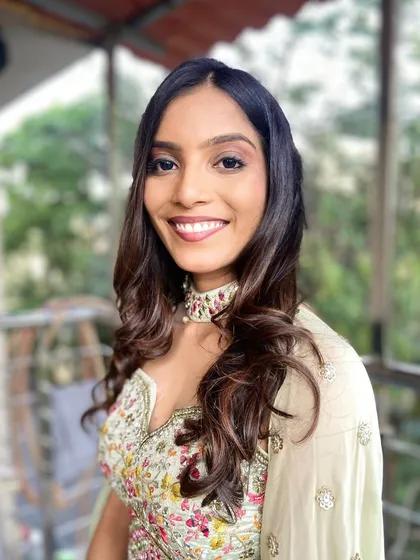 A radiant smile on this beautiful bride for her Roka ceremony. I created a delicate, glowing makeup look with soft curls to match her elegant and fresh style.
