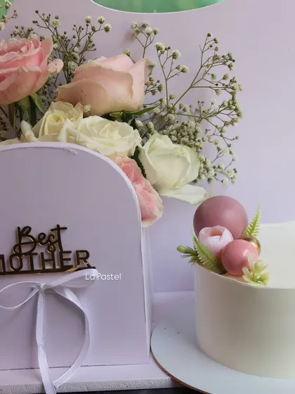 A detailed shot of the minimalist cake and flower box from the Mother's Day hamper collection.