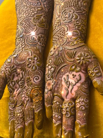 Another example of a personalized bridal mehendi, with the groom's name beautifully integrated into the design.