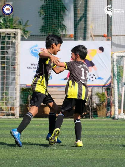 The joy of the game and the bond between teammates. Our Young Guns celebrating a goal, showcasing the team spirit we build from day one.