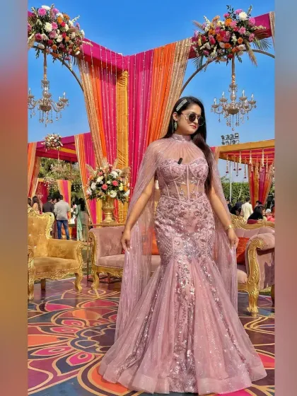 A look from a vibrant day-time wedding event. I love dressing for the occasion, and this elegant pink gown was perfect for a sunny, floral-themed celebration, ensuring I complement the decor and the mood.