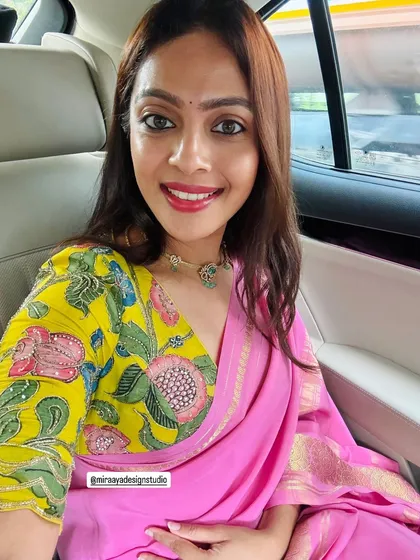 Sometimes a selfie says it all. I love seeing my clients happy, like Bhavani in her custom-fit, brightly colored floral blouse that perfectly captures her vibrant personality.
