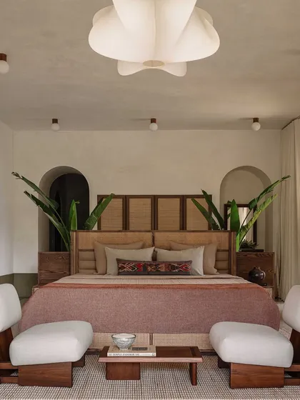 In this bedroom at the DUA Villa, we demonstrate how grand architectural concepts can translate into serene, intimate spaces. The design frames the view, making the lush exterior an integral part of the room's calm and restorative atmosphere.