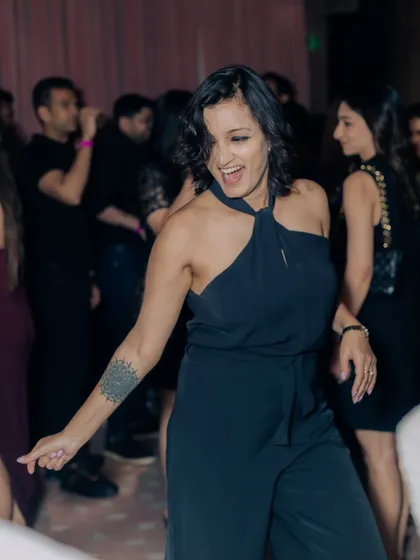A candid shot of a guest enjoying the dance floor at our Salsa Night. Our goal is to create an atmosphere where everyone feels free to let loose and have fun.