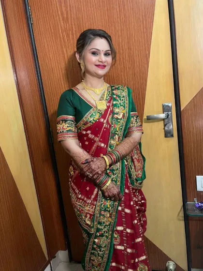 A full-length shot of the client, looking graceful and elegant in her saree.
