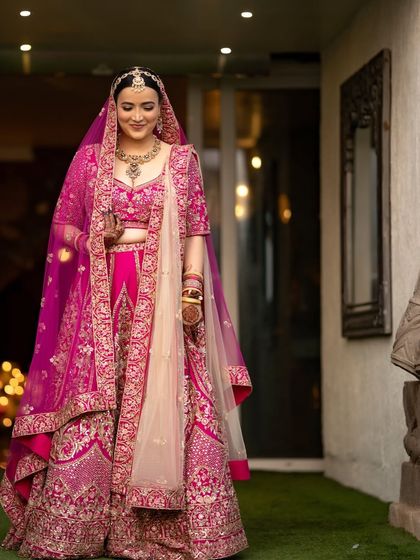 An elegant portrait of the bride, her gentle smile and beautiful attire captured in soft, flattering light.