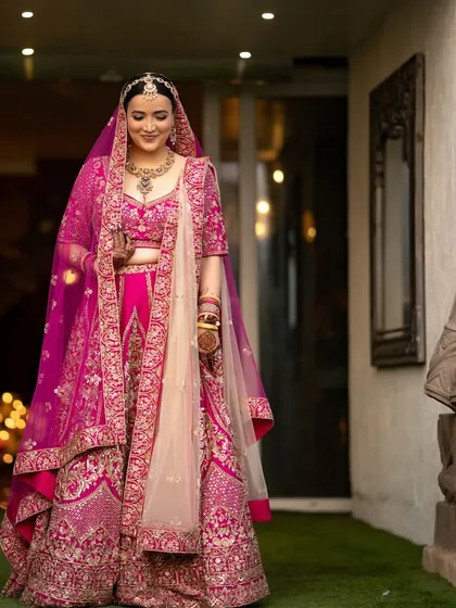 An elegant portrait of the bride, her gentle smile and beautiful attire captured in soft, flattering light.