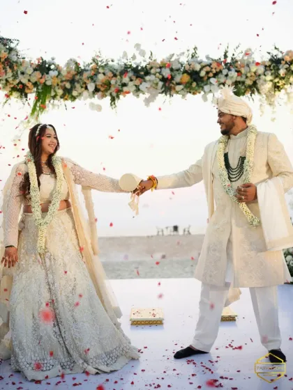 A fun, dancing shot of the couple. The bride's makeup is designed to be comfortable and long-lasting, allowing her to enjoy every moment.