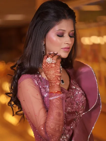 A close-up of the bride's sangeet makeup, featuring dramatic smokey eyes and a beautiful diamond ring.