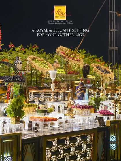 A royal and elegant setting for your gatherings. This wide shot captures the scale and beauty of our dessert and fruit displays, creating a truly grand spectacle.