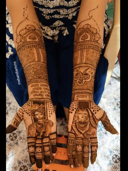 This bridal mehandi combines portraits of the couple with their names written in a beautiful script. The design also includes traditional symbols for a complete wedding look.