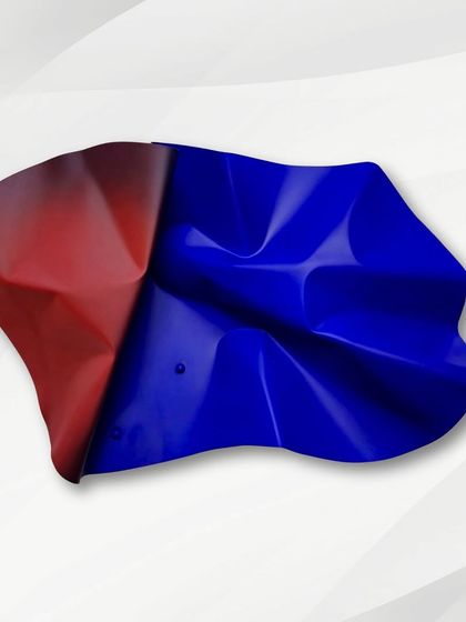 A bold fusion of contrasting colors, this Meteor piece blends vibrant red and deep blue on a single, fluidly shaped form.