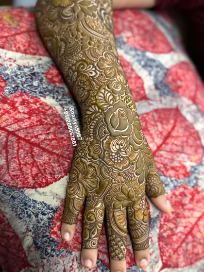 A close-up of the rose and leaf details on the back of the arm. The shading technique makes the flowers look almost three-dimensional.