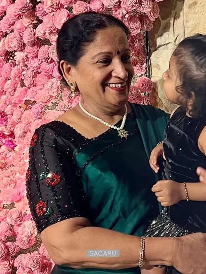 A client defining the perfect cocktail saree outfit, with a delicately hand-embroidered floral bead and sequin blouse.