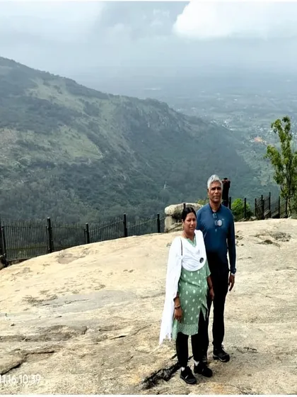 A couple enjoying the view from the hills we visit as part of our Adiyogi day trip.