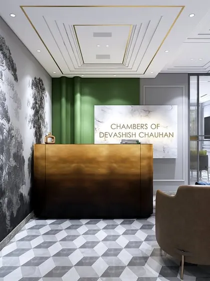 Another angle of the reception, highlighting the detailed ceiling, 3D wallpaper, and ombre-finish desk. The space is designed to align with the overall functionality and sophistication of the office.