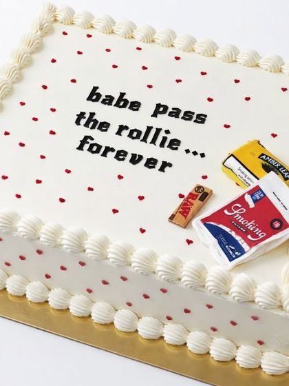 This has to be one of the coolest wedding cakes we've ever made. The cheeky "babe pass the rollie... forever" message is a perfect example of how we can customize a cake to be nonchalant, cute, and totally personal.