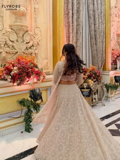 The back view of this elegant lehenga highlights the flow of the skirt and the beautiful craftsmanship. Perfect for making an exit as memorable as your entrance.