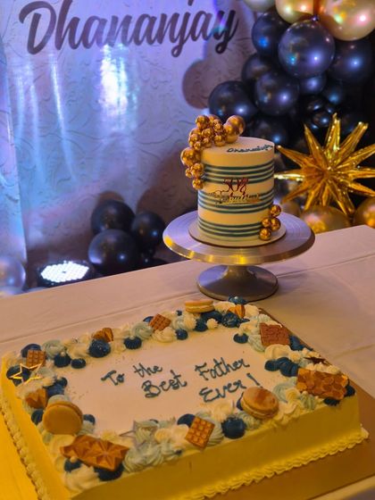 A shot of the dessert table at my dad's 50th birthday, featuring the two cakes I made for him.