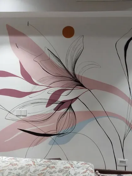 This boho mural with pastel shades is in a bedroom. The combination of abstract color shapes and fine line art creates a dreamy and artistic atmosphere.