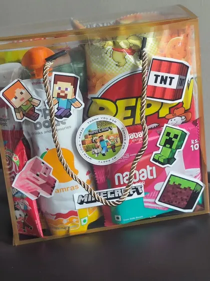 Beyond soaps, I also curate complete gift bags. This Minecraft-themed bag is filled with assorted snacks, drinks, and a stationery set, all customized with game