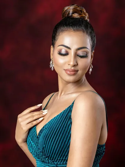 This shot highlights the beautiful, shimmering eyeshadow from a masterclass look. The closed eyes draw full attention to the detailed blending and glitter application techniques I teach.