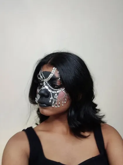 Another view of the black and silver rhinestone mask.
