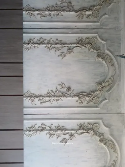 The completed South Mount mural installed on the wall. The heritage-inspired design features elegant floral garlands that frame the panels, creating a sophisticated and classic look.