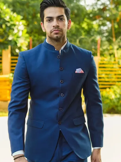 A classic Jodhpuri suit in a striking royal blue. This is a versatile piece that you can wear for any wedding function or formal event. The fit is impeccable, and the solid color makes it a powerful and stylish choice.