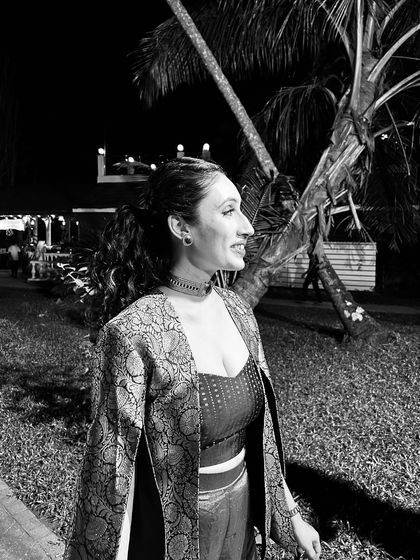 The bride's sangeet look, inspired by the Bollywood disco era, featuring a Banarasi and bling theme that was both nostalgic and sexy.